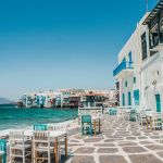 white and brown concrete buildings near sea during daytime