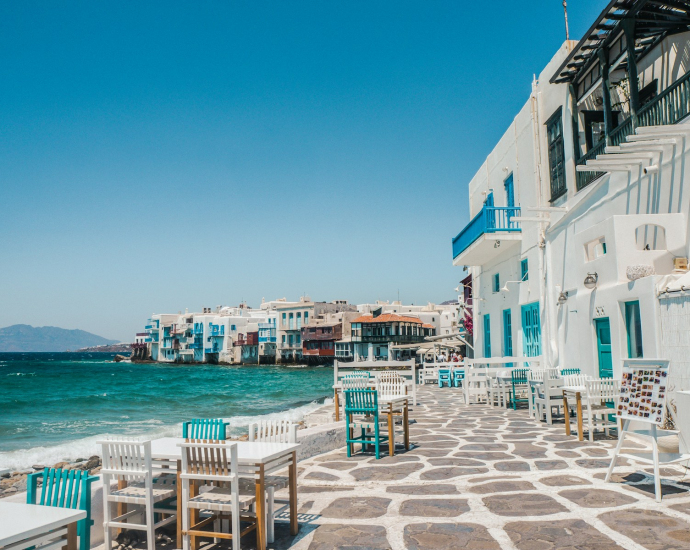 white and brown concrete buildings near sea during daytime